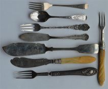 A collection of butter knives, pickle forks etc. A