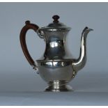 A heavy baluster shaped coffee pot with hinged top