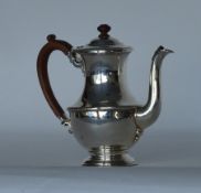 A heavy baluster shaped coffee pot with hinged top