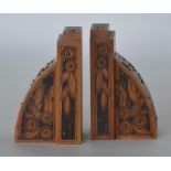 A good pair of carved bookends with brass decorati