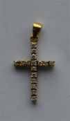 A large diamond cross in 18 carat gold with loop t