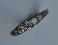 A good quality diamond five stone ring in 18 carat