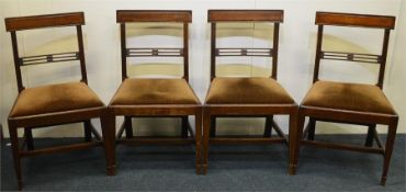 A set of four mahogany dining chairs with slip in