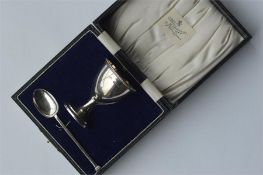 A boxed egg cup and spoon with reeded sides. Est.