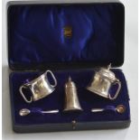 An unusual boxed three piece cruet with hinged top
