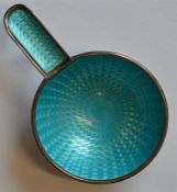 A small silver and enamelled ashtray with ring mou