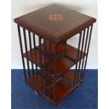 A revolving bookcase with shell inlay. Est. £60 -