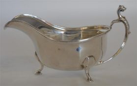 A good sauce boat with reeded rim and panelled sid