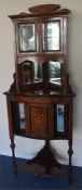 An attractive rosewood inlaid corner cupboard with