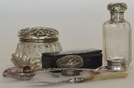 A box containing embossed top jars, picture frame,