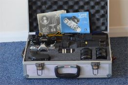 A good Canon automatic cased camera together with