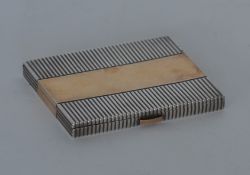 A French Art Deco compact with reeded decoration and g