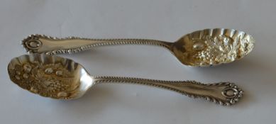 A good pair of large berry spoons with gadroon rim