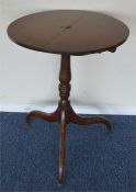 An Antique pedestal table together with one other.