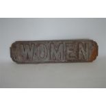 A cast iron railway toilet door sign, "Women". Est