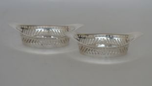 A pair of canoe shaped bonbon dishes with pierced