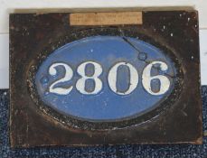 A cast iron number plate, "2806". Approx. 15 cms w