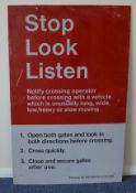 A modern era reflective "Stop, Look Listen" warnin