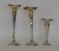 A group of three silver mounted spill vases with w