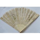 A carved ivory and lace fan. Est. £20 - £30.