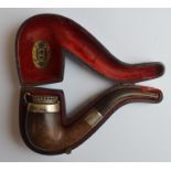 An unusual silver mounted pipe with hinged top and