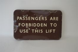 A brown enamel railway sign, "Passengers are Forbi