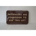 A brown enamel railway sign, "Passengers are Forbi