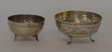 A small silver Continental sugar bowl on three hoo