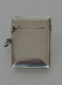 A silver hinged top vesta case with loop mount. Ap