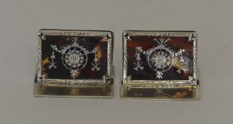 A pair of attractive silver and tortoiseshell menu