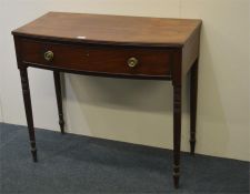 An Antique mahogany single drawer side table with