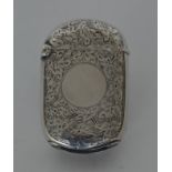 An attractive engraved vesta case with hinged top.