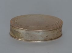 An oval Georgian style box with engine turned deco