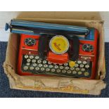 A Mettoy Mettype junior tinplate toy typewriter. E