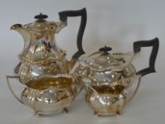 A heavy silver four piece tea and coffee service w