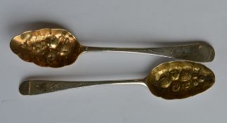 Two heavily embossed bright cut berry spoons with