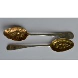 Two heavily embossed bright cut berry spoons with
