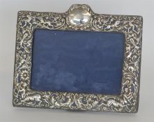 An embossed picture frame, the border attractively