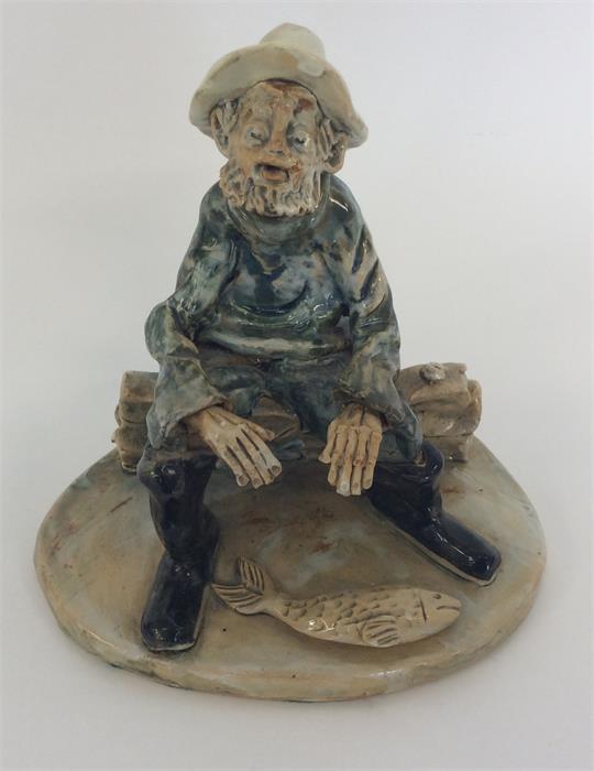 NORMAN UNDERHILL : A figure of a fisherman seated