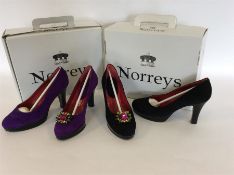 NORREYS: A pair of purple suede leather shoes with