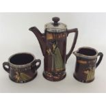 A Royal Doulton silver mounted three piece coffee