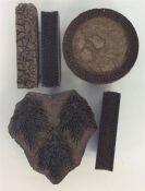 A group of three carved wooden printing blocks wit