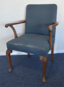 A large mahogany carver chair with upholstered bac