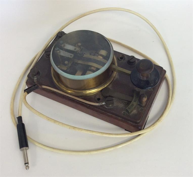 A World War II Morse code machine. Est. £20 - £30.