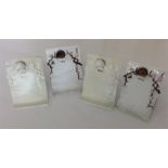 An unusual set of four menu holders attractively d