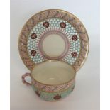A Royal Worcester decorated cup and saucer with pi