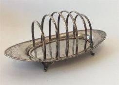 A domed five division toast rack of oval form. Lon