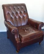 A large button back leather armchair together with