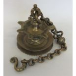 An unusual Antique brass wall hanging on suspensio