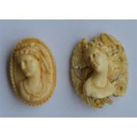 An oval carved ivory cameo of a lady's head togeth